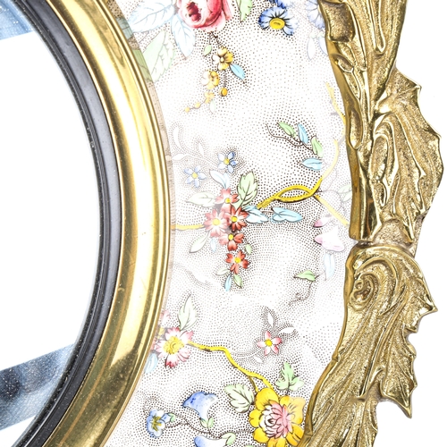 1143 - A Spode floral decorated ceramic-framed convex wall mirror, with gilt-bronze leaf decorated surround... 