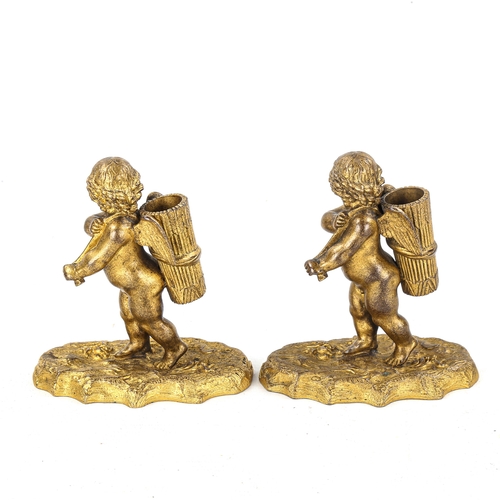 1146 - A pair of Victorian Elkington gilt-bronze cherub design spill holders, height 11cm