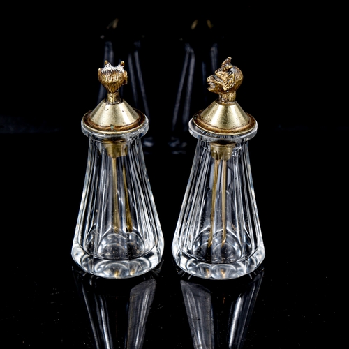 1149 - A pair of small cut-glass perfume bottles, with plated Pan head mounted lids with attached spoons, h... 