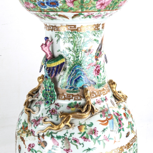 1163 - A pair of Chinese 19th century famille rose porcelain vases, with dragon and bird figures to the nec... 