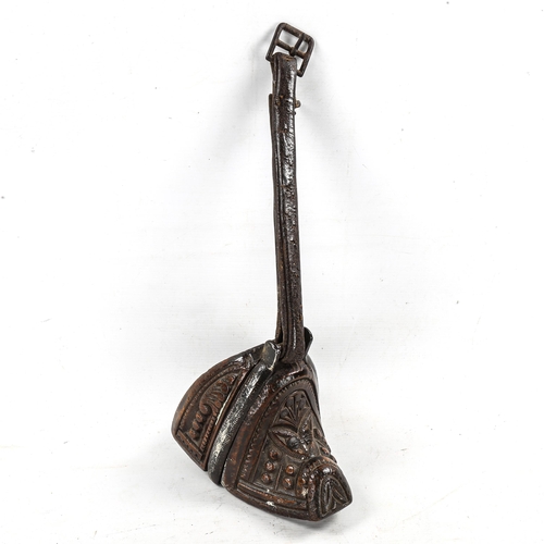 1175 - An Antique Mongolian relief carved wood stirrup, with steel-mount and leather strap