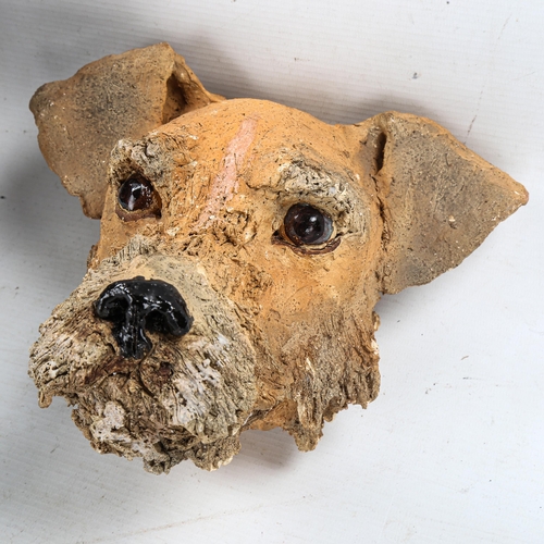 1184 - 2 hand sculpted clay wall-mounted dog's heads, largest height 25cm