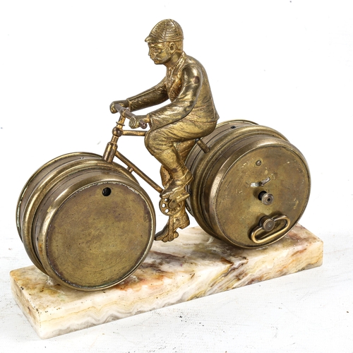 1187 - An unusual Victorian gilt-brass novelty desk clock/barometer, in the form of a man on a bicycle, on ... 