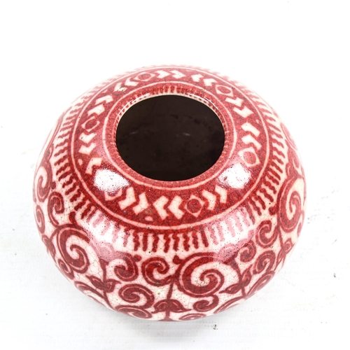 1196 - A Delft Pottery vase, with hand painted iron red design, signed with monogram, diameter 12cm