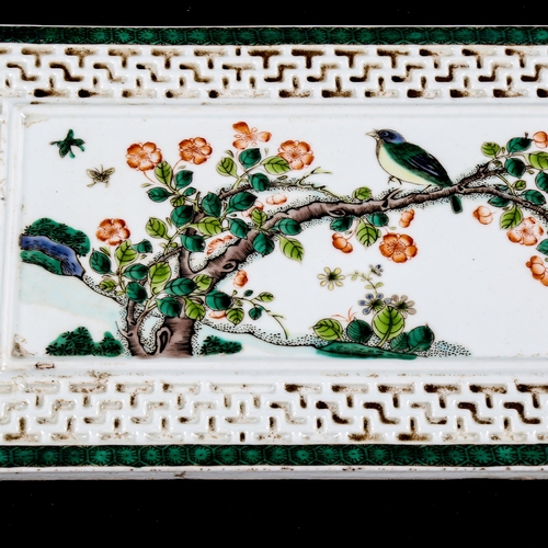 1203 - A pair of Chinese porcelain plaques, with painted birds and blossom, in embossed surrounds, 31cm x 1... 