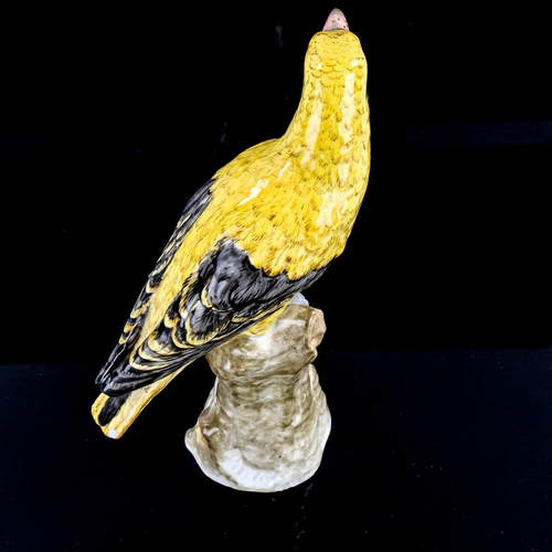 1219 - A German porcelain figure of a yellow bird, blue under-glaze mark, height 21cm