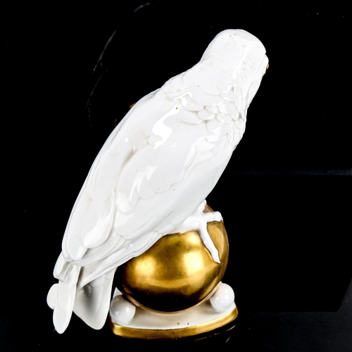 1220 - Hutschenreuther gilded white glaze porcelain parrot, height 20cm