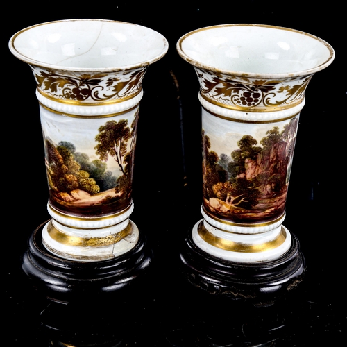 1225 - A pair of 19th century Crown Derby vases, with hand painted panoramic friezes, height 11cm, on woode... 