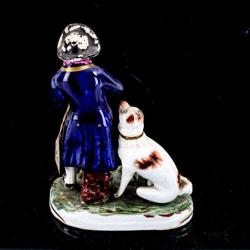 1231 - A 19th century Staffordshire porcelain figure of a man with a dog, height 15cm