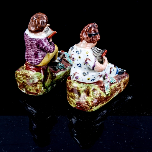 1250 - Pair of small Staffordshire china figures of children reading books, height 9cm