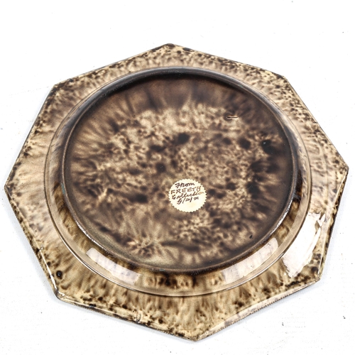 1254 - 19th century octagonal pottery plate, with tortoiseshell effect mottle glaze, label verso from Freet... 