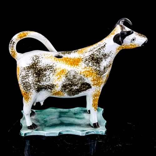 1264 - A Staffordshire Pottery cow creamer jug, length 15cm