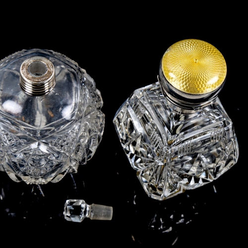 1285 - A cut-glass perfume bottle with silver and enamel hinged top, and another cut-glass perfume bottle (... 