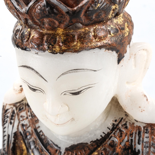 1308 - An Oriental carved alabaster Mudra Buddha, with painted and gilded decoration, on modern plinth, ove... 