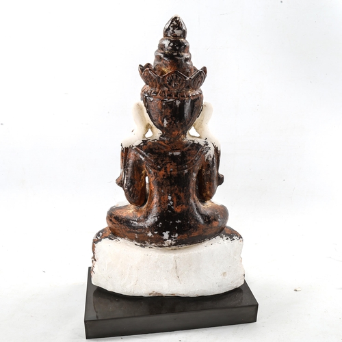 1308 - An Oriental carved alabaster Mudra Buddha, with painted and gilded decoration, on modern plinth, ove... 