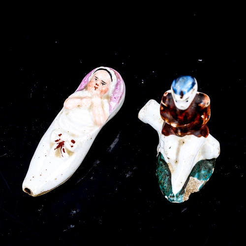 1324 - A 19th century porcelain whistle, in the form of a baby in a shoe, length 6.5cm, and a porcelain whi... 