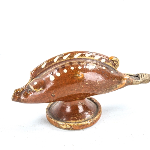 1330 - A Wealden type brown glaze pottery whistle, in the form of a fish, length 13cm