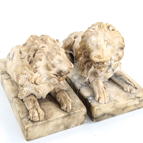 1338 - A pair of 19th century carved marble recumbent lions, length 19.5cm (A/F)