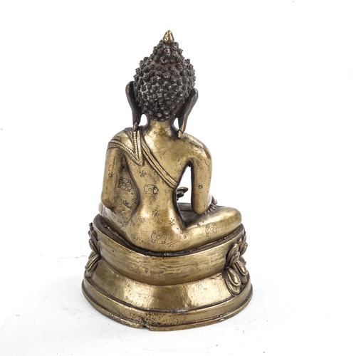 1340 - A Chinese gilt-bronze seated Buddha, height 24cm