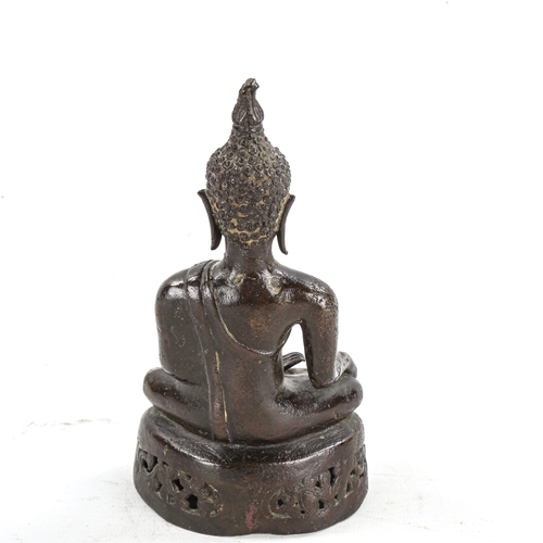 1341 - An Oriental patinated bronze seated Buddha, height 17cm