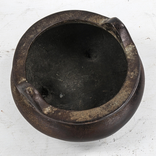 1370 - A Chinese patinated bronze incense burner, impressed seal mark under base, diameter 14cm