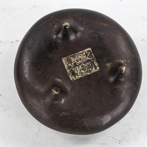 1370 - A Chinese patinated bronze incense burner, impressed seal mark under base, diameter 14cm