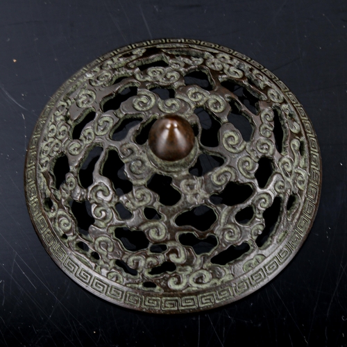 1374 - A Chinese patinated bronze incense burner, with cast pierced cover, impressed mark under base, diame... 