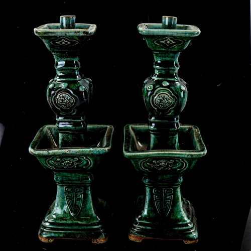 1376 - A pair of Chinese green glazed ceramic candle stands, height 25cm, and a sang de boeuf glaze parrot,... 