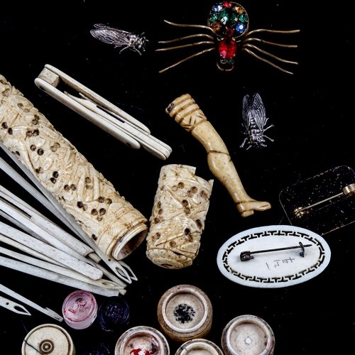 1377 - A group of antique ivory and bone items, including a sectional seal holder, 3 stone seals, and paste... 