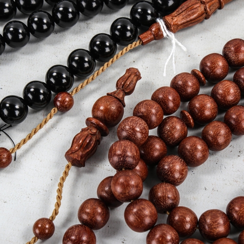 1399 - 2 strings of Islamic prayer beads, Kuka wood and Black Amber