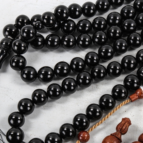 1399 - 2 strings of Islamic prayer beads, Kuka wood and Black Amber