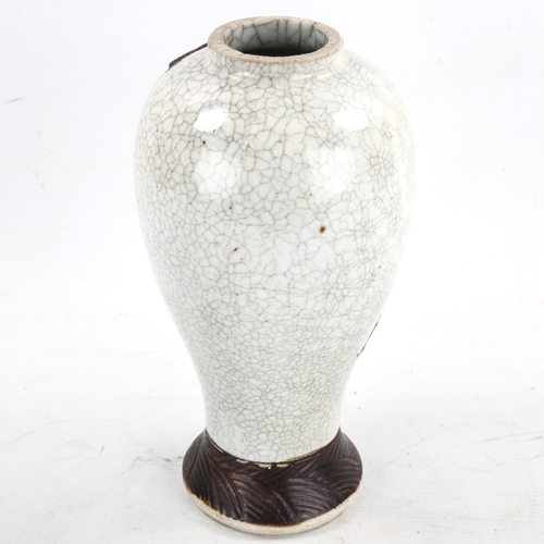 1410 - A Chinese crackle glaze porcelain vase, with relief dragon design, height 24cm