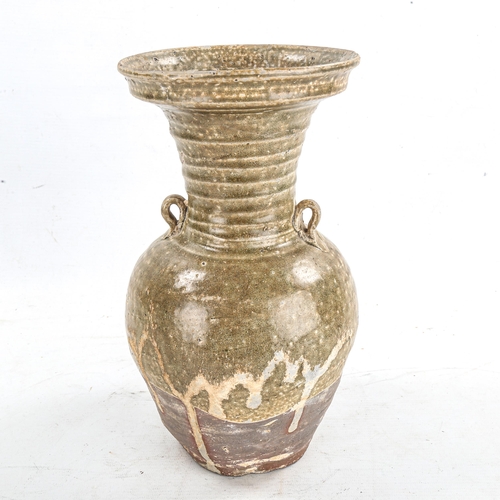 1412 - A Chinese Han Dynasty Hu form vase with ring handles, height 27cm, rim diameter 14cm