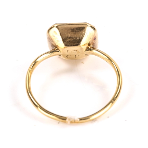 100 - A mid-18th century rock crystal hair panel memorial ring, unmarked gold closed-back settings, with s... 