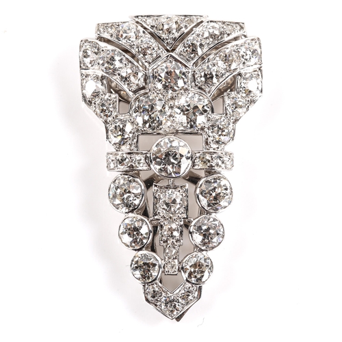 103 - An Art Deco diamond scarf clip brooch, set with old cut diamonds and rose cut diamond accents, total... 