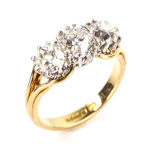 104 - A late 20th century 18ct white and yellow gold 3-stone diamond ring, claw-set with cushion old cut a... 