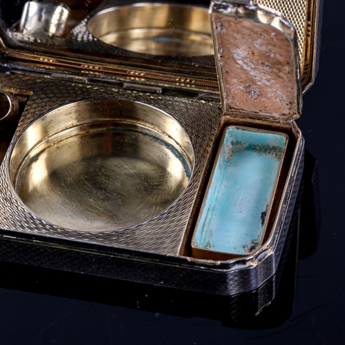 168 - A lady's Art Deco silver and blue enamel vanity case, allover engine turned decoration with gilt int... 