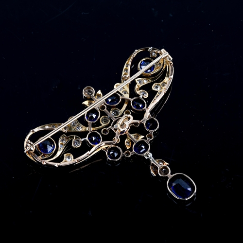 215 - A large Edwardian Art Noueau sapphire and diamond pendant / brooch, unmarked gold openwork settings ... 