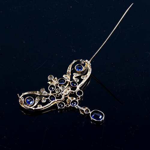 215 - A large Edwardian Art Noueau sapphire and diamond pendant / brooch, unmarked gold openwork settings ... 