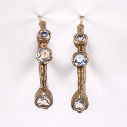 219 - A modern pair of silver gilt moonstone hoop earrings, textured settings with stud fittings and round... 