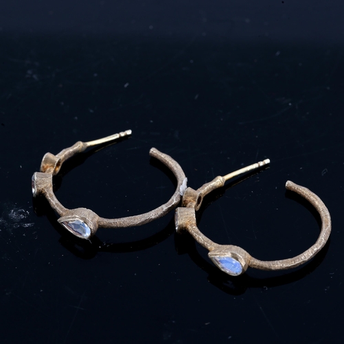 219 - A modern pair of silver gilt moonstone hoop earrings, textured settings with stud fittings and round... 