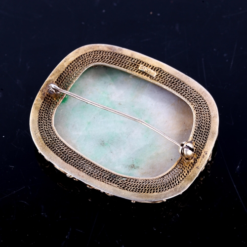 223 - A Chinese silver gilt jade panel brooch, polished tablet form with wirework filigree frame, brooch l... 