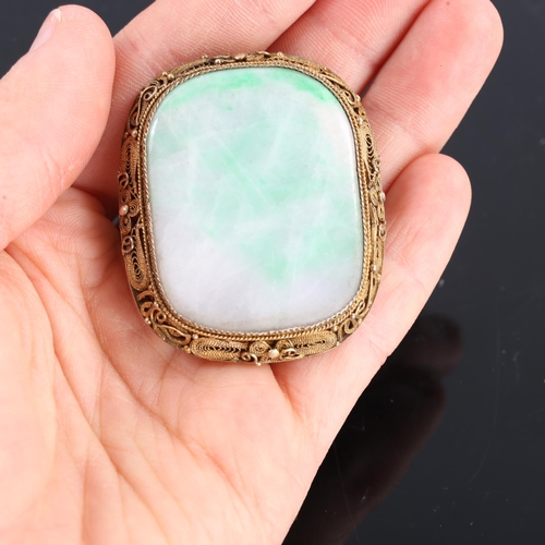 223 - A Chinese silver gilt jade panel brooch, polished tablet form with wirework filigree frame, brooch l... 