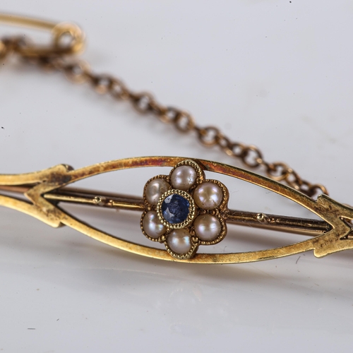 226 - An Edwardian 15ct gold sapphire and split pearl brooch, openwork floral design, brooch length 57.2mm... 