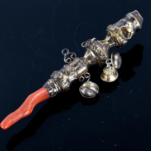 237 - A Victorian silver gilt baby's rattle, relief embossed foliate decoration with bells and coral teeth... 