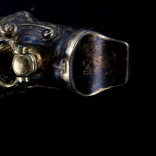 237 - A Victorian silver gilt baby's rattle, relief embossed foliate decoration with bells and coral teeth... 