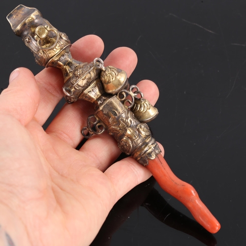 237 - A Victorian silver gilt baby's rattle, relief embossed foliate decoration with bells and coral teeth... 