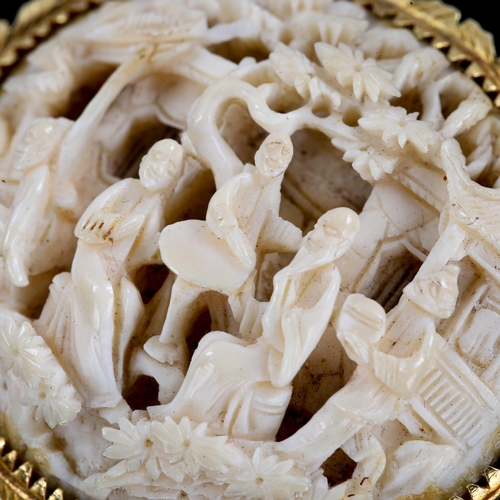 250 - An early 20th century Chinese carved ivory panel brooch, high relief and pierced village scene, in u... 