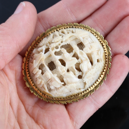 250 - An early 20th century Chinese carved ivory panel brooch, high relief and pierced village scene, in u... 