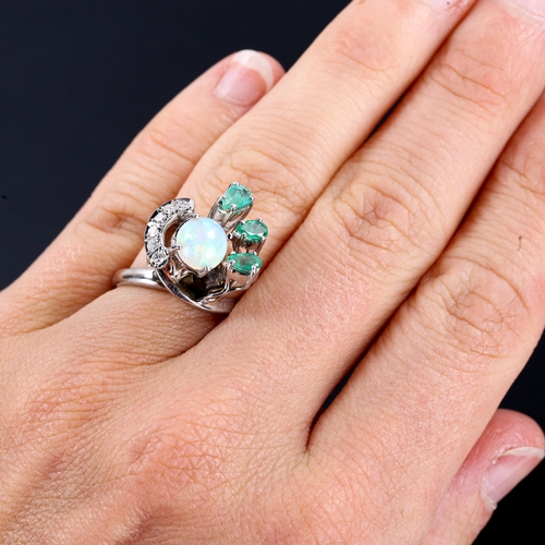 254 - A late 20th century 18ct white gold opal, emerald and diamond cocktail ring, set with round cabochon... 